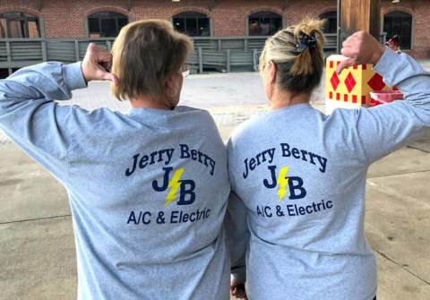 Jerry Berry A/C & Electric t-shirts worn by two of our office employees